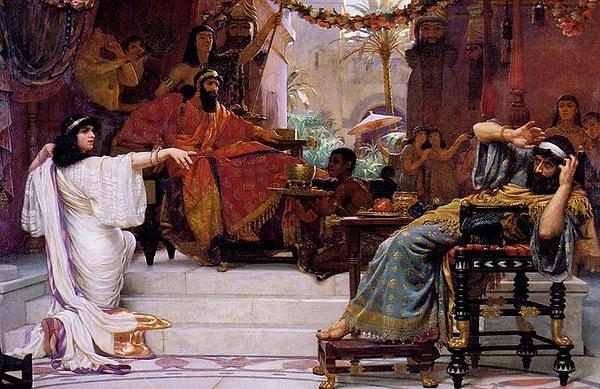Kral Xerxes Kraliçe Ester'e, "Böyle bir şeyi yapmaya cesaret eden kim, nerede bu adam?" diye sorar. Ester, "Düşmanımız, hasmımız, işte bu kötü Haman'dır!" der.