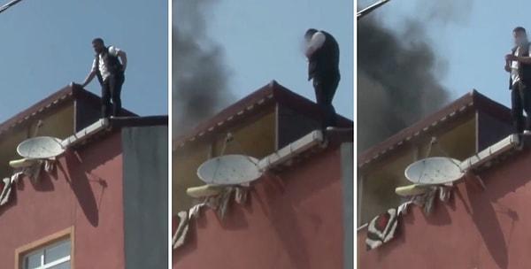 Genç kız kurtarıldıktan sonra çatıda kalan bir vatandaş sigarasını yakarak itfaiyenin gelmesini bekledi.