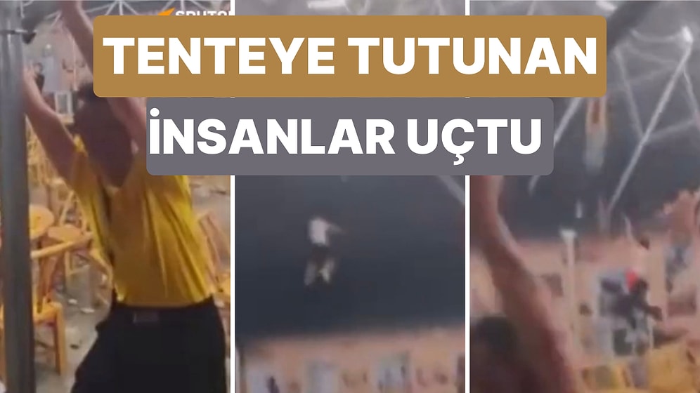 Çin'de Çıkan Fırtınada Uçmasın Diye Bir Tenteyi Tutmaya Çalışan İnsanlar Şiddetli Rüzgarın Etkisiyle Savruldu