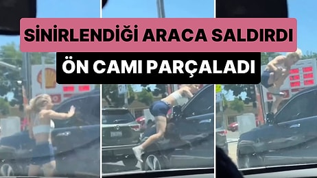 Trafikte Sinirlendiği Aracın Üzerine Atlayan Kadın Tekme Atarak Camı Parçaladı