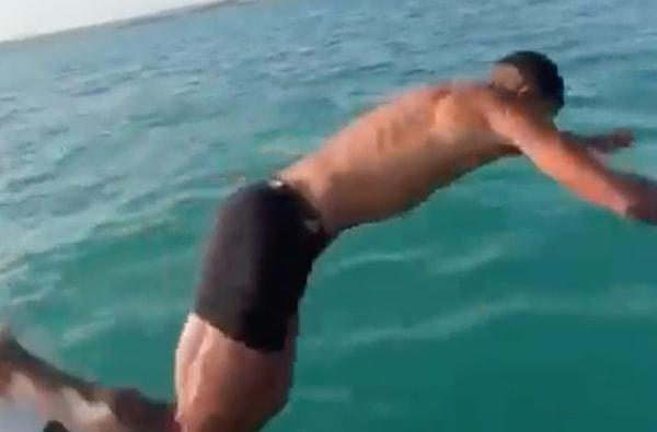 Sıcağın 40 dereceyi bulduğu Adana'da ünlü futbolcu kendini  Seyhan Baraj Gölü'nün serin sularına bıraktı.