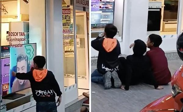 Bir başka dükkan sahibi de kendi dükkanının önünde televizyon izlemeye çalışan çocuklar için çizgi film açtığı görüntüleri paylaştı.