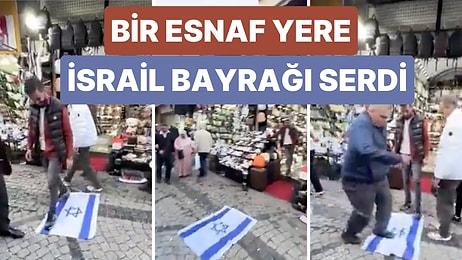 İstanbul'da Bir Esnaf Yere İsrail Bayrağı Serdi ve Yoldan Geçen İnsanların Üzerine Basarak Geçmesini Sağladı