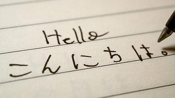 Which country has the official language known as "Nihongo"?