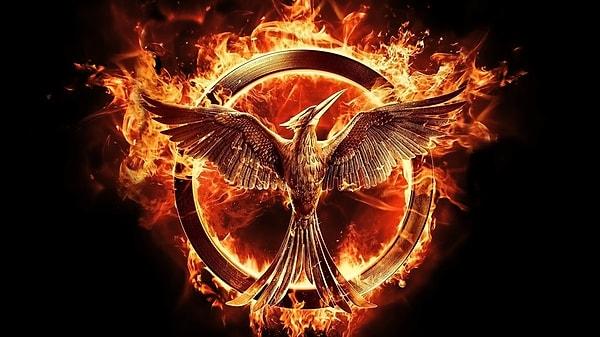 How does the mockingjay become a symbol of rebellion in the series?