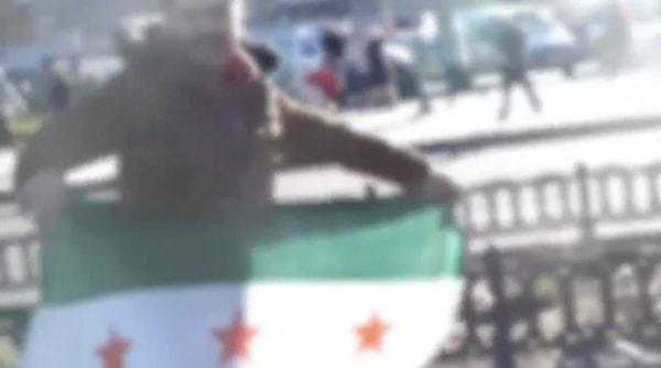 Kayseri'de gerçekleştirilen mitingde bir genç Özgür Suriye Ordusu bayrağı açınca bir vatandaştan tepki geldi.