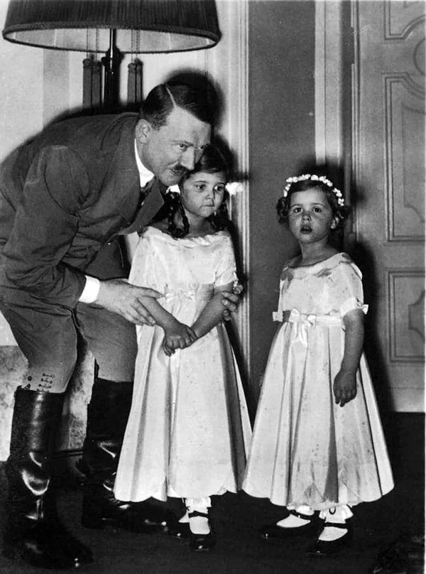 1. Adolf Hitler speaking with Goebbels' daughters.