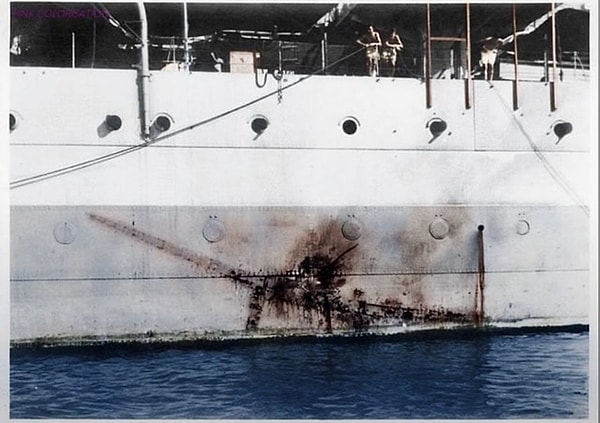 4. The mark left by a Mitsubishi Kamikaze Zero on the side of H.M.S. Sussex. 1945.