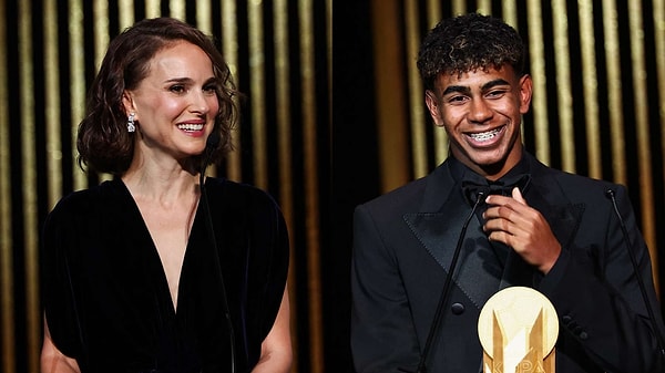 The 17-year-old posed for a photo with famous actress Natalie Portman before receiving his award.