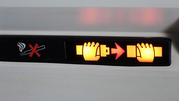 Finally, passengers should not stand up when the seatbelt sign is on. Standing up before the plane has fully landed increases the risk of injury.