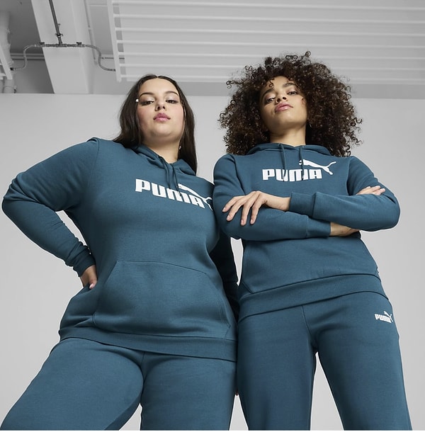 Puma Kadın Uzun Kollu Üst ESS Logo Hoody FL, konforu ve şıklığı bir arada sunan, gardırobunuzun vazgeçilmezi olacak bir parça.