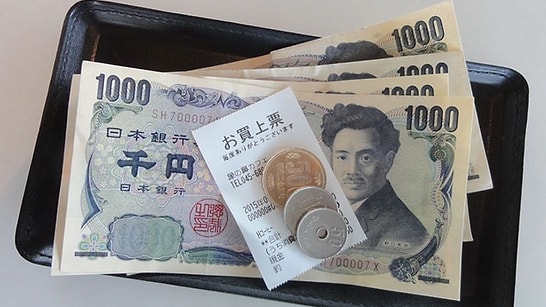 Why Do Japanese People Give Money in a Special Tray?