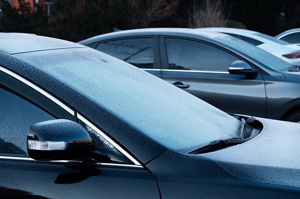 It's possible for the ice on the windshield to thaw on its own, eliminating the need for a scraper.