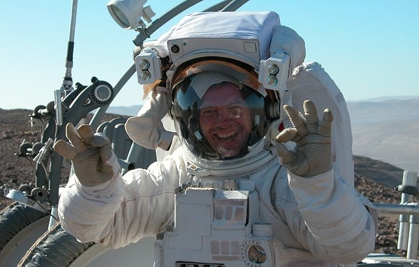 Upon their return to Earth, astronauts are extracted from their capsules on stretchers.