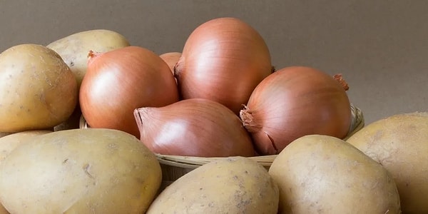 In virtually every household, potatoes and onions are often found stored side by side, either in the same pantry cupboard or in the same basket.