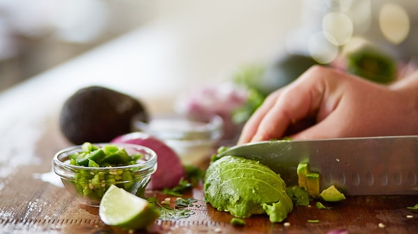 Celebrated chef Nick Stellino succinctly encapsulates the formula for preserving the creamy green hue of an avocado and halting its chemical reaction in a single sentence: "Slice the avocado with a plastic or ceramic knife."