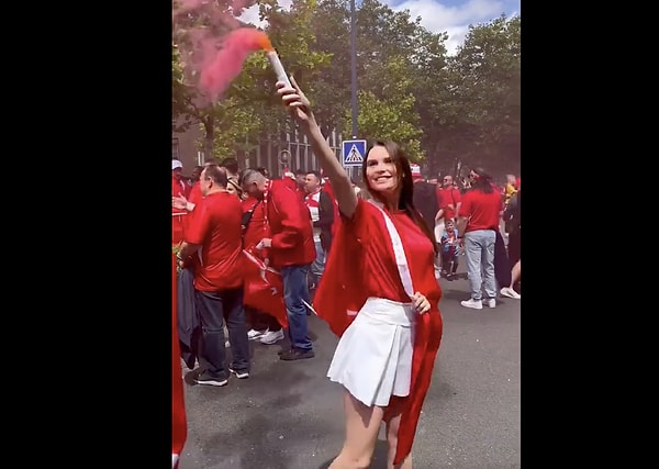 As the winds of Turkey blew in Canada, Svetlana Alekseeva seamlessly blended into the enthusiastic crowd of fans. With her pink smoke flare and the Turkish flag draped around her, she didn't feel out of place amidst the throng.