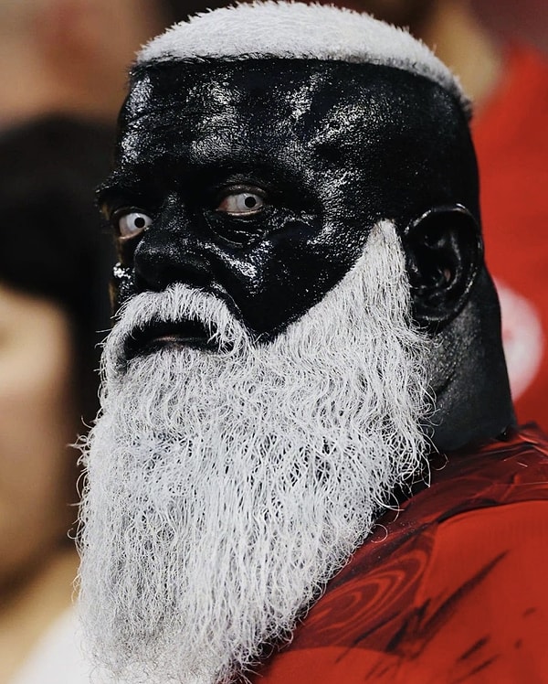 He's painting his face black, putting on white lenses... This fanatic fan has become a global talking point.