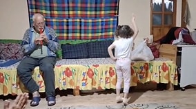 Pure Joy: Sweet Little Girl Warming Hearts While Dancing to Her Grandpa's Flute