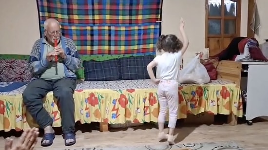 Pure Joy: Sweet Little Girl Warming Hearts While Dancing to Her Grandpa's Flute