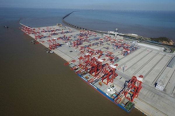 The Donghai Bridge, a six-lane, 32-kilometer long structure, was constructed to facilitate the transportation of unloaded cargo to the mainland across the ocean.