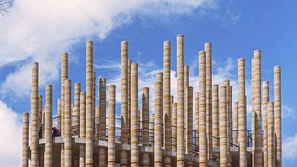 The bricks threaded onto steel rods created colorful columns.