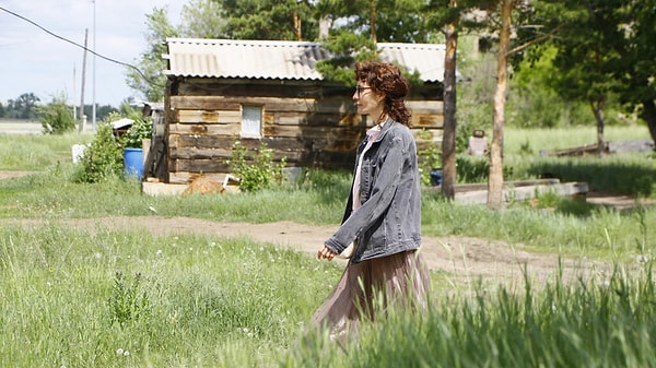 Yulia Sadvakasova, a 33-year-old teacher and mother of two, appreciates the tranquility of her surroundings and the ease of watching over her children. However, she acknowledges the harshness of her circumstances, stating, "Everything is in a terrible state. Whenever we get a chance, as challenging as it may be, we go places."